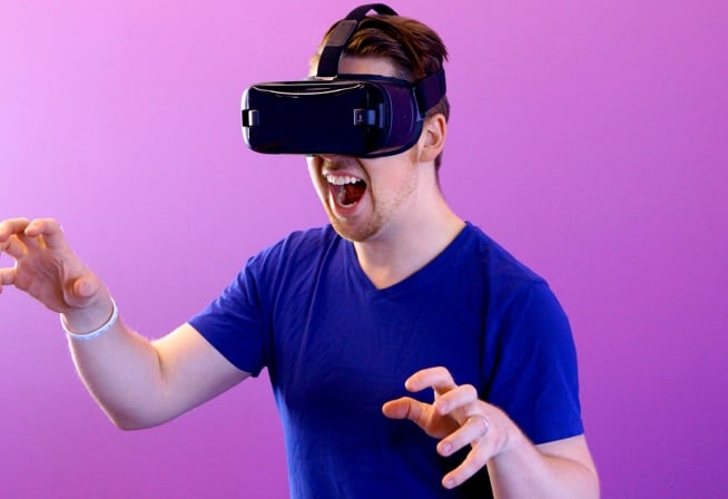 Image of a man wearing a VR glass and enjoying the show